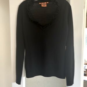 Tory Burch neck wool seater with ruffle detail at neck.